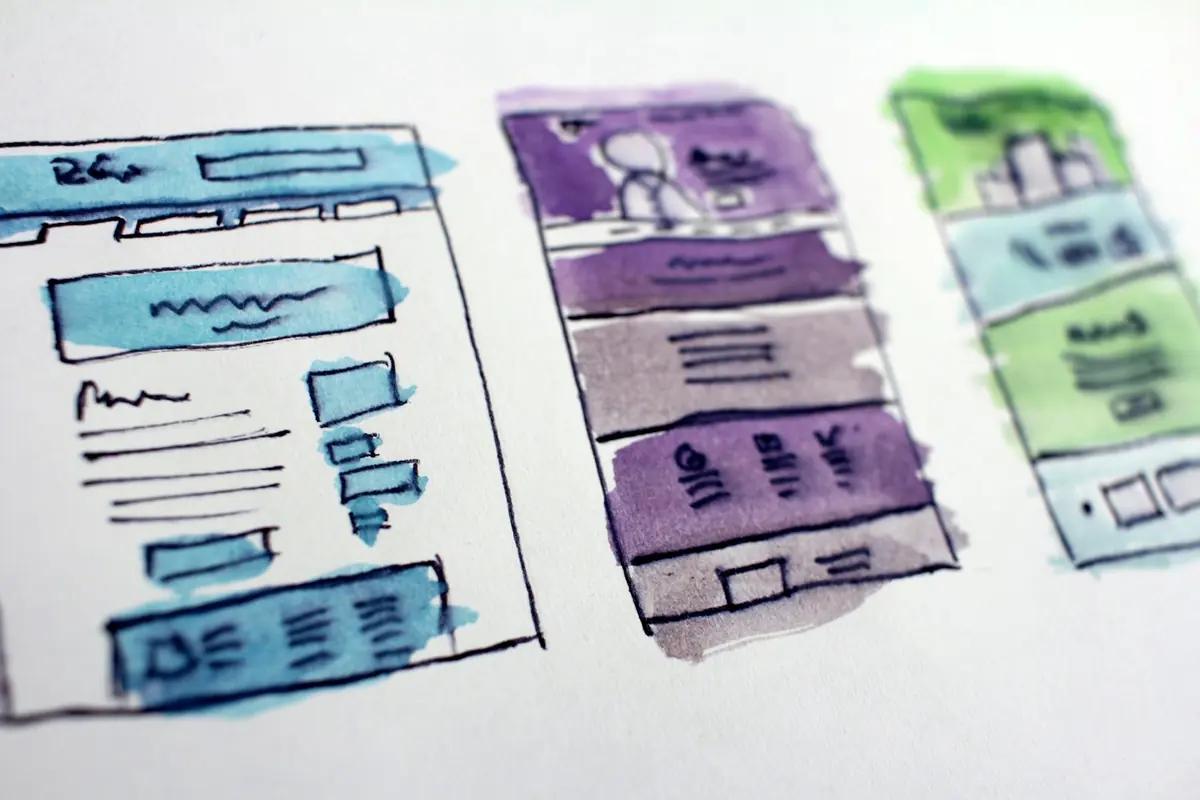 Website layout wireframes sketched out on paper